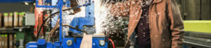 cover image sparks flying at a blue machine