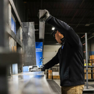 male employee cutting saw blades